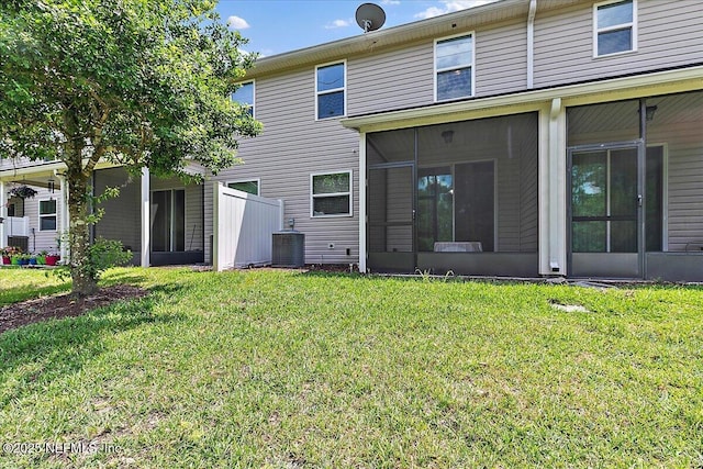 229 Adelanto Ave, Saint Augustine, FL 32092 - back of house with a sunroom, a yard, and cooling unit