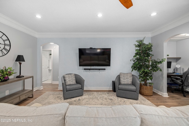 14526 Starbuck Springs Way, Jacksonville, FL 32258 - living room featuring arched walkways, wood finished floors, an office area, ornamental molding, and recessed lighting