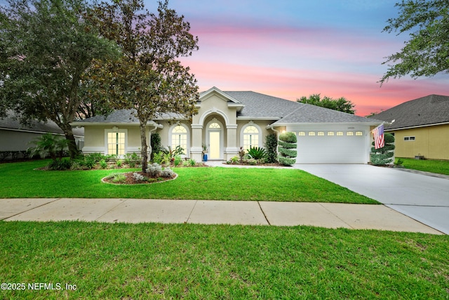 14526 Starbuck Springs Way, Jacksonville, FL 32258 - view of front facade with driveway, a garage, stucco siding, and a front yard