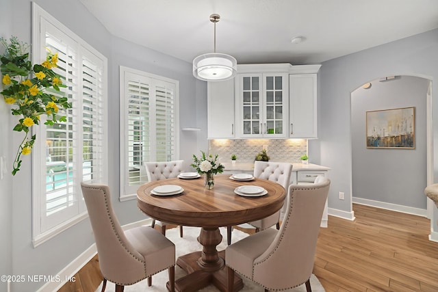 14526 Starbuck Springs Way, Jacksonville, FL 32258 - dining room with arched walkways and light wood finished floors