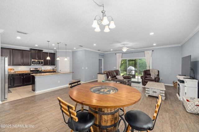 221 Saint Kitts Loop, Saint Augustine, FL 32092 - dining area with recessed lighting, a chandelier, ceiling fan, light wood-style floors, and ornamental molding