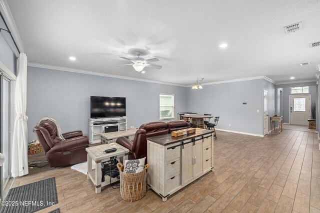 221 Saint Kitts Loop, Saint Augustine, FL 32092 - living room featuring plenty of natural light, light wood-style floors, a ceiling fan, recessed lighting, and crown molding