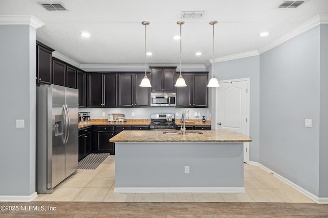 221 Saint Kitts Loop, Saint Augustine, FL 32092 - kitchen featuring stainless steel appliances, light stone counters, ornamental molding, an island with sink, and recessed lighting