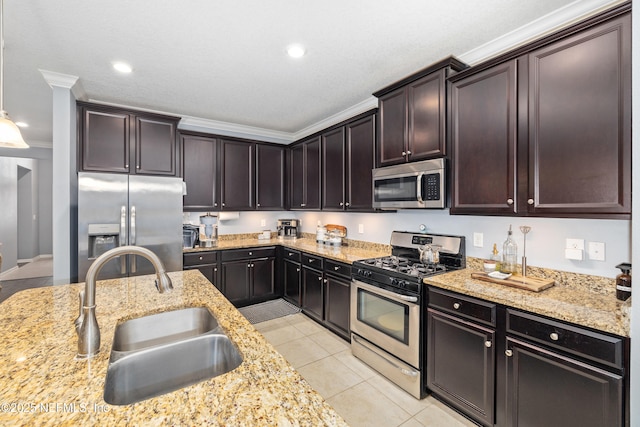 221 Saint Kitts Loop, Saint Augustine, FL 32092 - kitchen with appliances with stainless steel finishes, light tile patterned floors, light stone countertops, crown molding, and dark brown cabinets