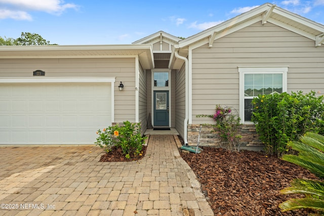 221 Saint Kitts Loop, Saint Augustine, FL 32092 - doorway to property featuring driveway and a garage