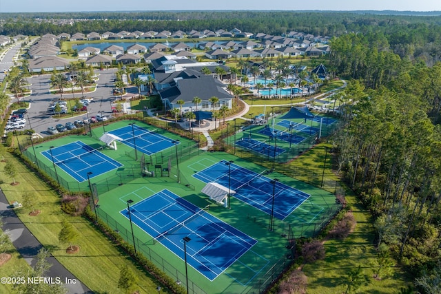 birds eye view of property featuring a view of trees and a residential view