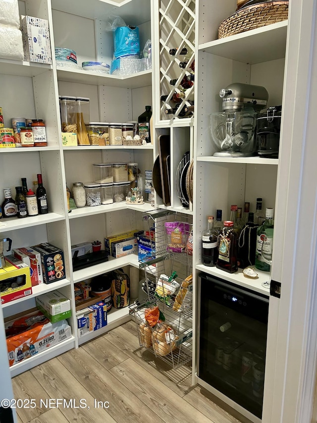 pantry featuring wine cooler