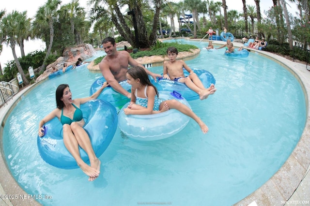 pool featuring a water play area