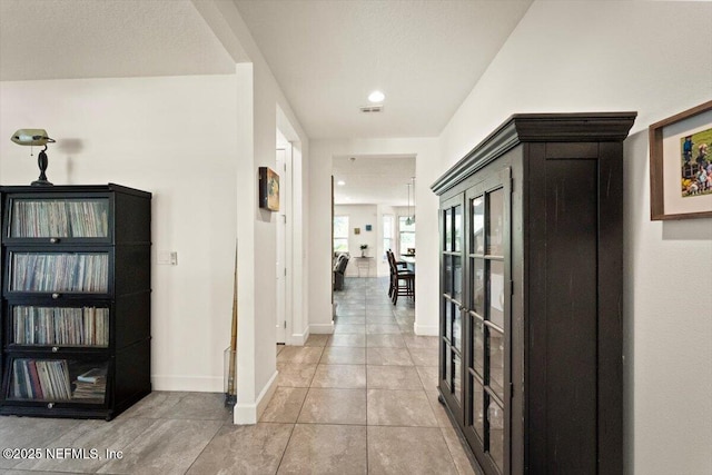 341 Aspen Leaf Dr, Jacksonville, FL 32081 - hallway with baseboards, light tile patterned floors, and recessed lighting