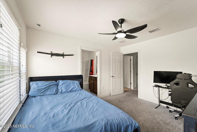 341 Aspen Leaf Dr, Jacksonville, FL 32081 - carpeted bedroom featuring a textured ceiling, baseboards, an office area, ceiling fan, and ensuite bath