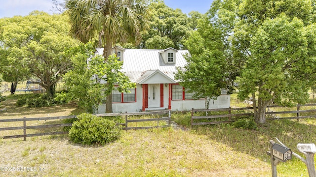 37885 Kings Ferry Rd, Hilliard, FL 32046 - view of front of home featuring metal roof and a fenced front yard