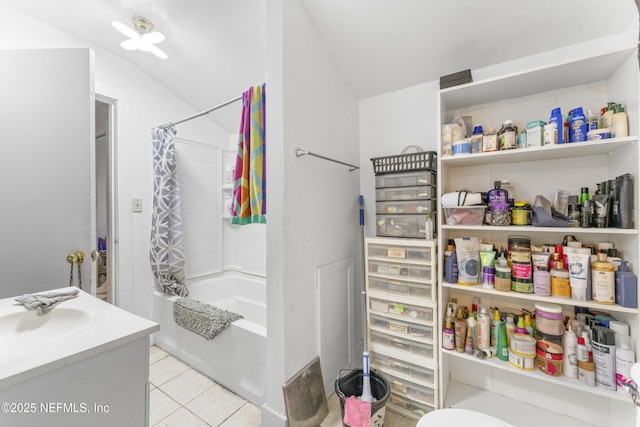 37885 Kings Ferry Rd, Hilliard, FL 32046 - bathroom featuring tile patterned flooring, lofted ceiling, shower / bathtub combination with curtain, and vanity