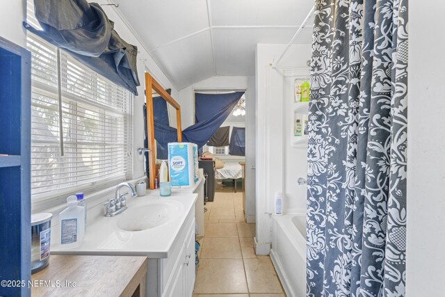 37885 Kings Ferry Rd, Hilliard, FL 32046 - bathroom with tile patterned floors, vanity, shower / bath combination with curtain, and vaulted ceiling