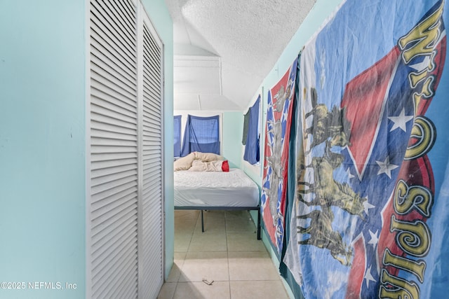 37885 Kings Ferry Rd, Hilliard, FL 32046 - tiled bedroom featuring a textured ceiling