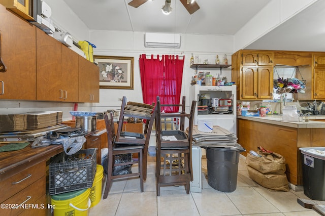 37885 Kings Ferry Rd, Hilliard, FL 32046 - kitchen with a ceiling fan, brown cabinets, light tile patterned flooring, and a wall mounted AC