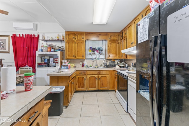 37885 Kings Ferry Rd, Hilliard, FL 32046 - kitchen with freestanding refrigerator, brown cabinetry, light tile patterned floors, a sink, and range with electric stovetop
