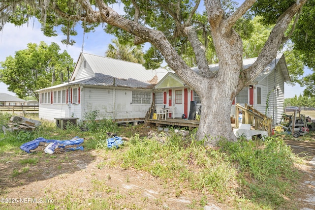 37885 Kings Ferry Rd, Hilliard, FL 32046 - back of property with metal roof and a deck