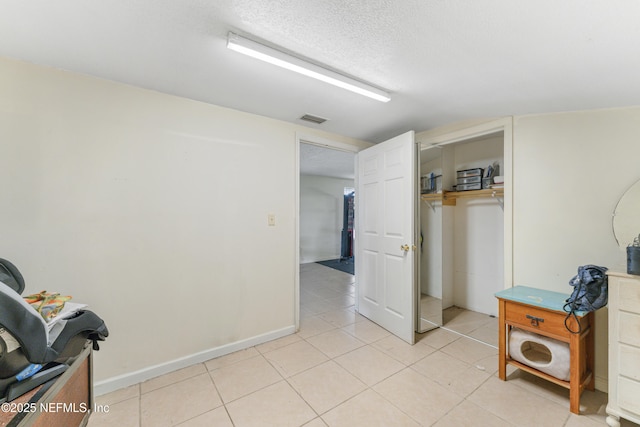 37885 Kings Ferry Rd, Hilliard, FL 32046 - interior space featuring light tile patterned floors, visible vents, and a textured ceiling