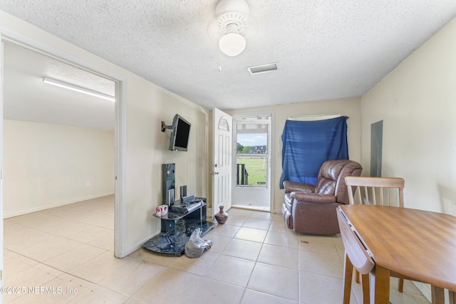 37885 Kings Ferry Rd, Hilliard, FL 32046 - dining room with a textured ceiling, visible vents, baseboards, and light tile patterned flooring