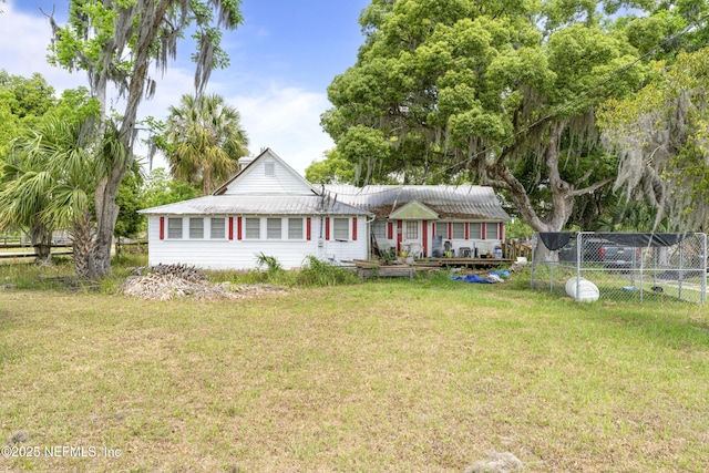 37885 Kings Ferry Rd, Hilliard, FL 32046 - ranch-style home with a front yard, a wooden deck, and fence