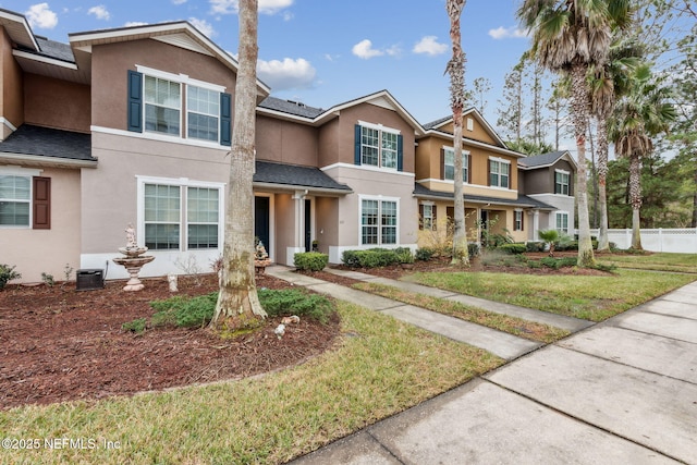 625 Oakleaf Plantation Pkwy Unit 1115, Orange Park, FL 32065 - view of front of property with a front yard, stucco siding, and fence