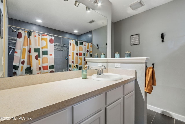 625 Oakleaf Plantation Pkwy Unit 1115, Orange Park, FL 32065 - bathroom with a tile shower, vanity, and visible vents