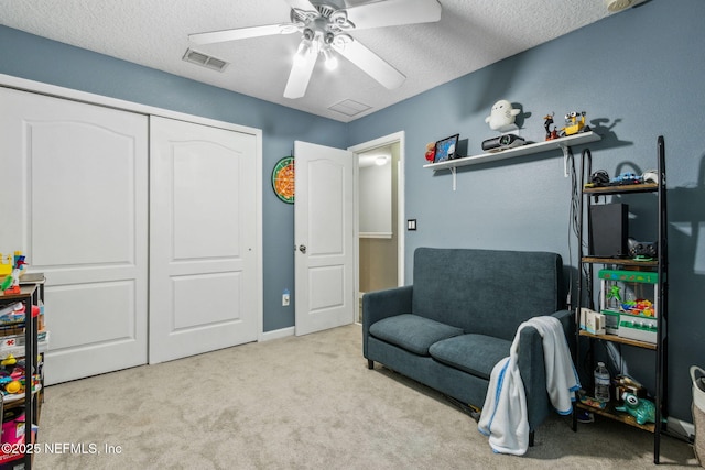 625 Oakleaf Plantation Pkwy Unit 1115, Orange Park, FL 32065 - living area featuring carpet flooring, a textured ceiling, visible vents, and a ceiling fan