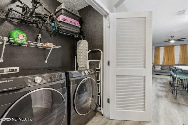 625 Oakleaf Plantation Pkwy Unit 1115, Orange Park, FL 32065 - washroom featuring wood finished floors, washing machine and clothes dryer, laundry area, visible vents, and ceiling fan