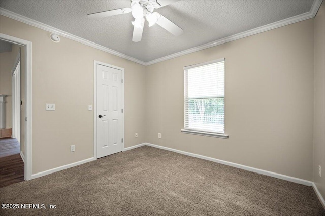 unfurnished room featuring ceiling fan, a textured ceiling, carpet, and baseboards