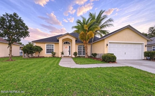 ranch-style home featuring concrete driveway, stucco siding, an attached garage, and a front lawn