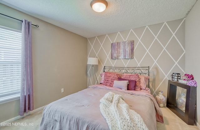 carpeted bedroom featuring a textured ceiling and baseboards