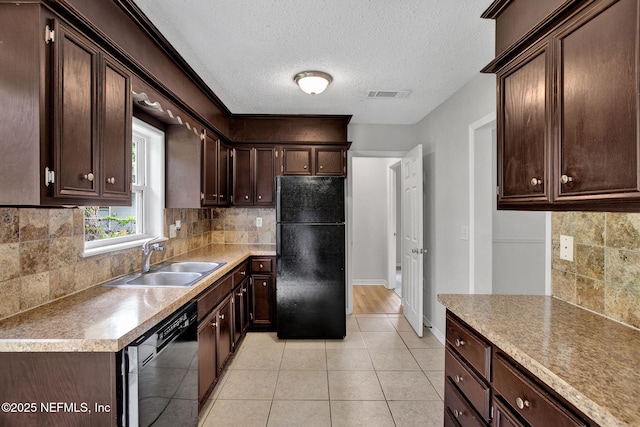 5417 Attleboro St, Jacksonville, FL 32205 - kitchen with black appliances, a sink, dark brown cabinetry, a textured ceiling, and tasteful backsplash