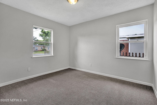 5417 Attleboro St, Jacksonville, FL 32205 - carpeted empty room with a textured ceiling and baseboards