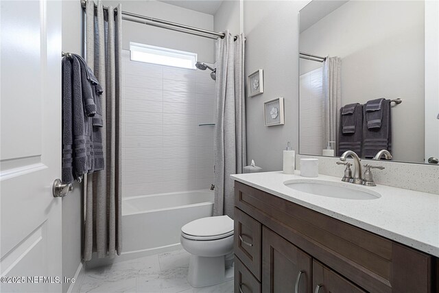 full bath with marble finish floors, toilet, vanity, and shower / bath combo with shower curtain