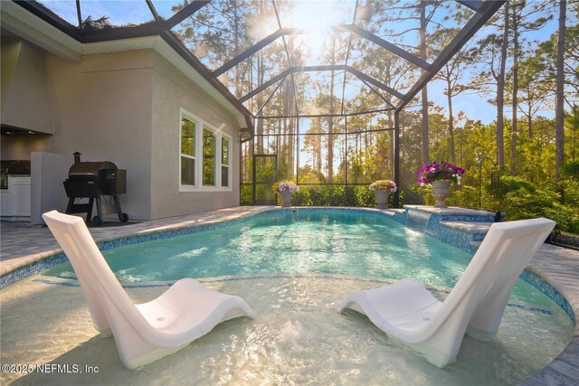 outdoor pool featuring a grill, a lanai, and a patio