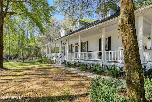 view of home's exterior featuring a yard and a porch