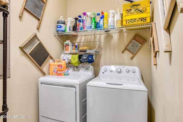 washroom featuring separate washer and dryer and laundry area