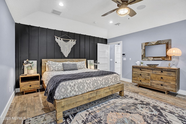 bedroom featuring wood finished floors, baseboards, ceiling fan, and recessed lighting