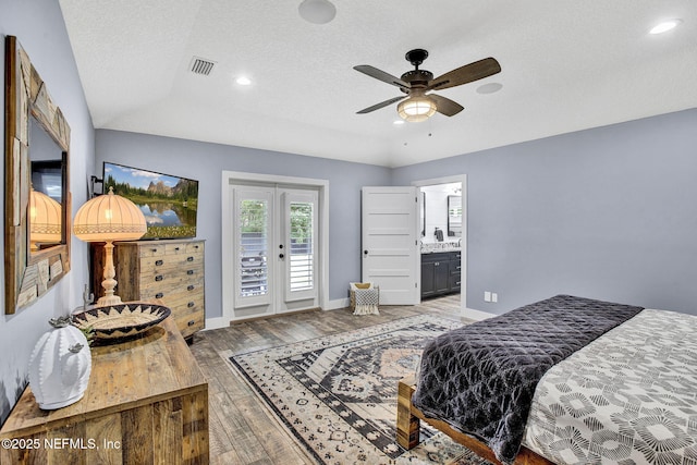 bedroom featuring access to exterior, light wood finished floors, baseboards, a textured ceiling, and recessed lighting