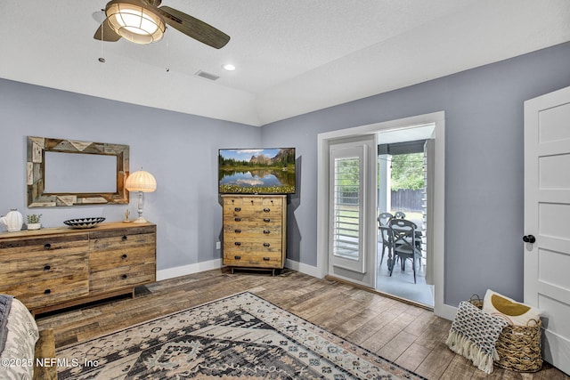 bedroom with wood finished floors, access to outside, baseboards, ceiling fan, and recessed lighting