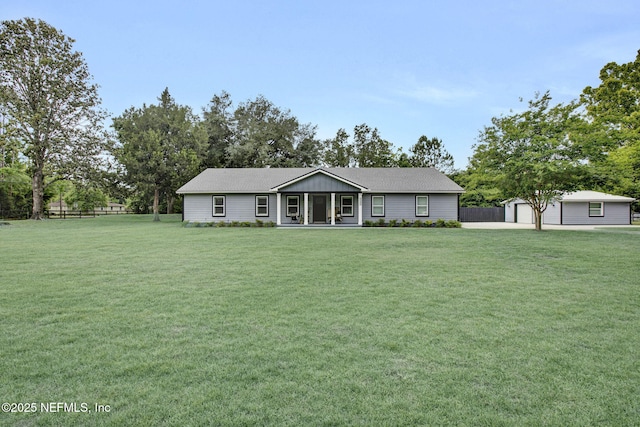 ranch-style house with an outbuilding and a garage