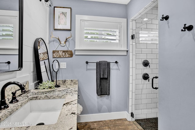 full bath featuring a shower stall and vanity