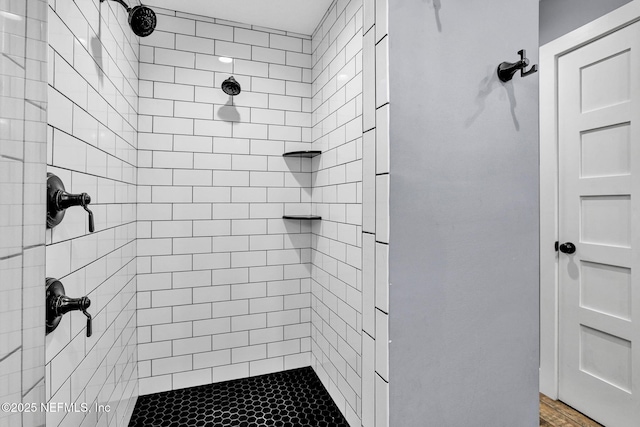 bathroom with tiled shower