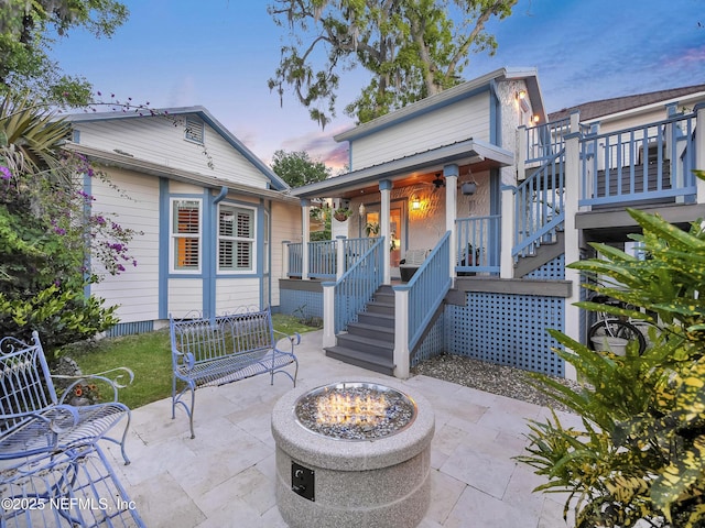 70 Weeden St + Guest House, Unit Guest House, Saint Augustine, FL 32084 - view of patio featuring stairway, a fire pit, and covered porch