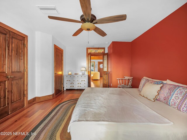 70 Weeden St + Guest House, Unit Guest House, Saint Augustine, FL 32084 - bedroom featuring baseboards, visible vents, a ceiling fan, and wood finished floors