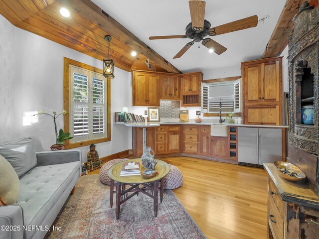 70 Weeden St + Guest House, Unit Guest House, Saint Augustine, FL 32084 - kitchen featuring lofted ceiling with beams, light wood-type flooring, a ceiling fan, hanging light fixtures, and built in fridge