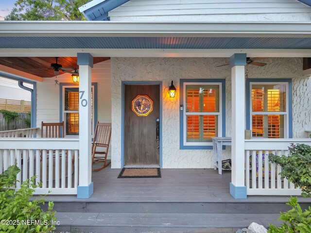 70 Weeden St + Guest House, Unit Guest House, Saint Augustine, FL 32084 - property entrance with covered porch, stucco siding, and a ceiling fan