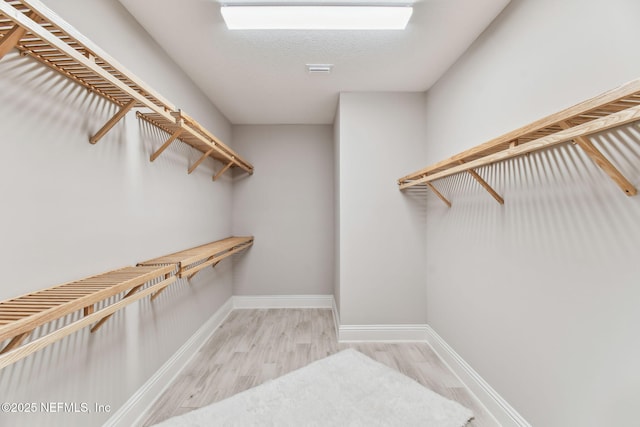 269 Fremont Ave, Saint Augustine, FL 32095 - walk in closet featuring wood finished floors