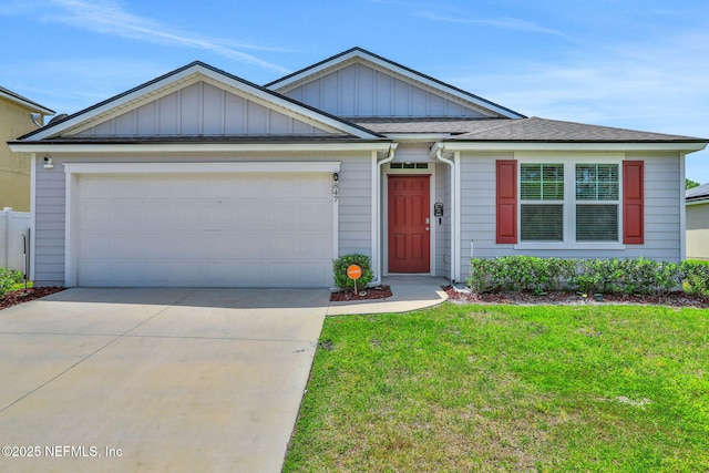 ranch-style home featuring a garage, a front lawn, board and batten siding, a shingled roof, and driveway