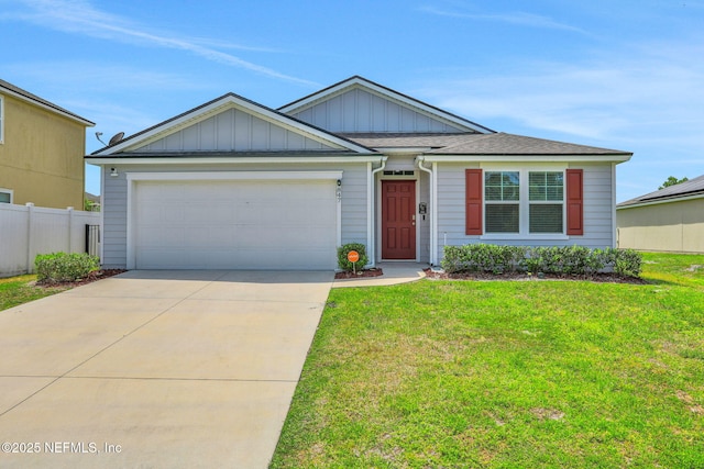 ranch-style home with fence, an attached garage, driveway, a front lawn, and board and batten siding